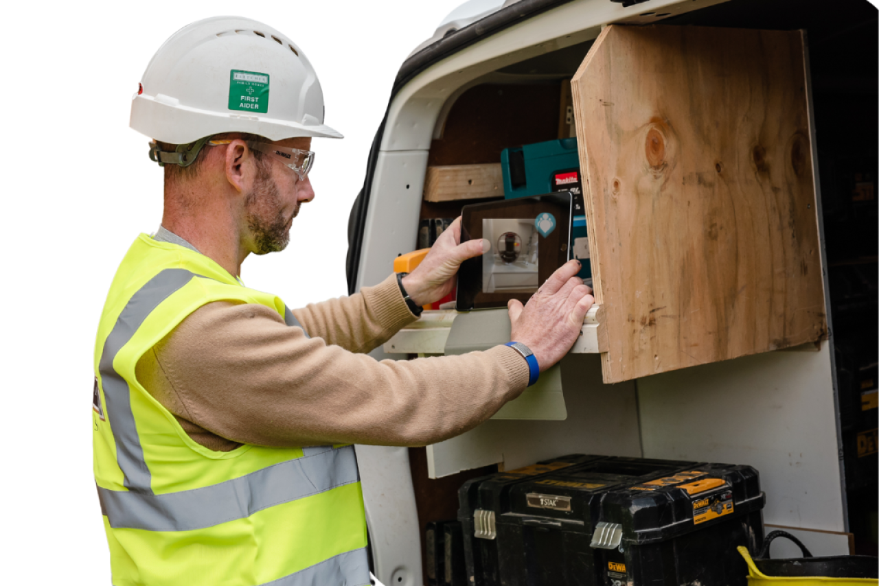 Technician using van stock management tool in Teampoint UK field management software.